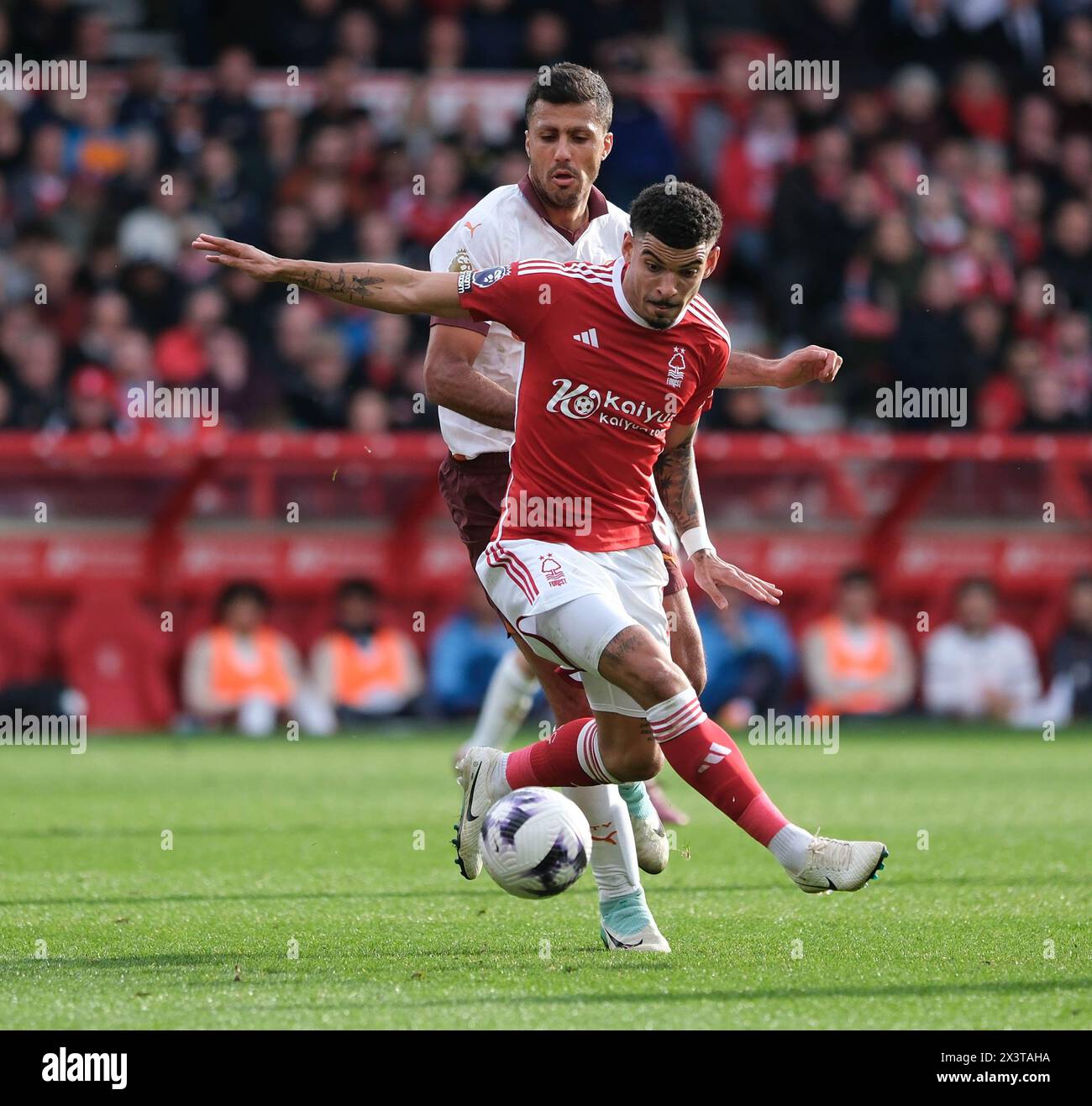 The City Ground, Nottingham, UK. 28th Apr, 2024. Premier League Football, Nottingham Forest versus Manchester City; Morgan Gibbs-White of Nottingham Forest under pressure from Rodrigo of Manchester City Credit: Action Plus Sports/Alamy Live News Stock Photo