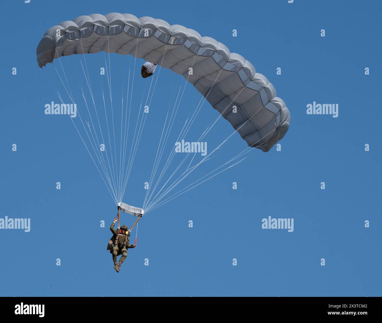 An Armed Forces of the Philippines jumper parachutes from a MC-130J ...