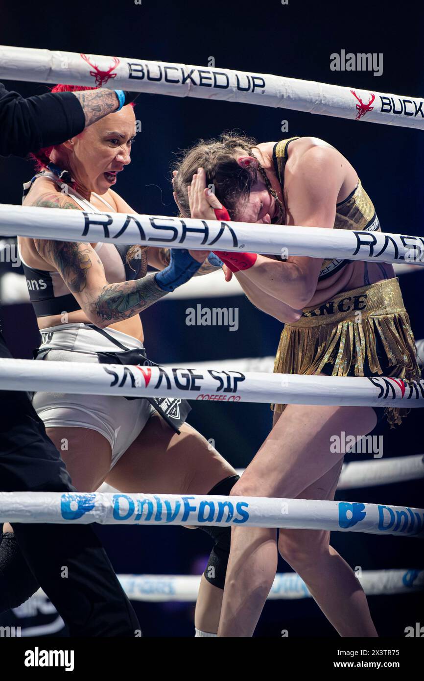 Crystal Pittman (left) upper cuts Sydney Smith (right) just before she K.O.s her and the ref calls the fight. Bare Knuckle Fighting Championship (BKFC) makes its Los Angeles debut at the Peacock Theater, hosting 'Knucklemania' with Mike Perry vs.Thiago Alves headlining the event. Known as the fastest growing Combat Sports Promotion in modern times, BKFC has brought in the attention of many, including important figures to the fighting community such as Conor Mcgregor who has just become part owner of the quickly growing sport. Stock Photo