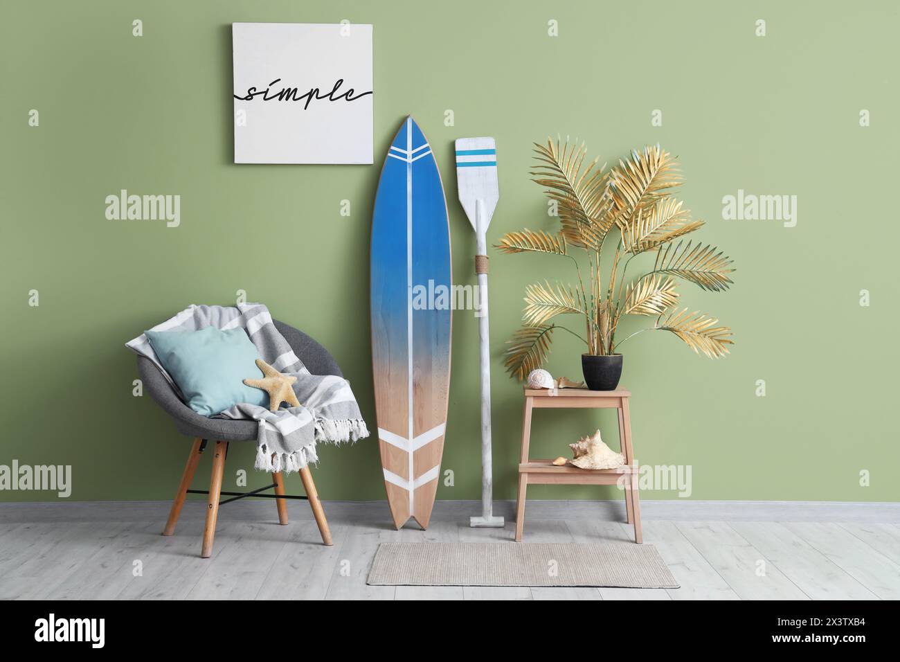 Interior of living room with surfboard, paddle and armchair Stock Photo ...