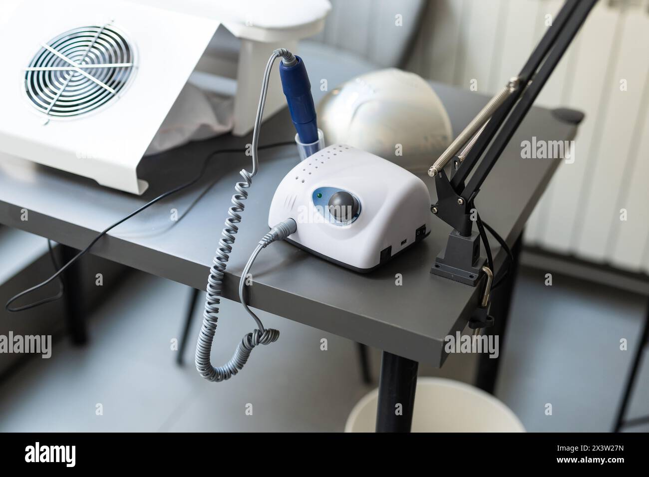 Electric manicure machine on table. Drill for manicure Stock Photo