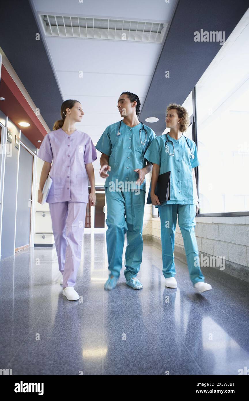 Team three nurses doctors walk hi-res stock photography and images - Alamy