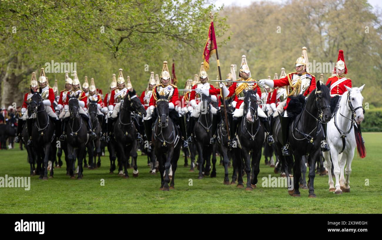 The trooper on the white horse carries a bugle which signals commands ...