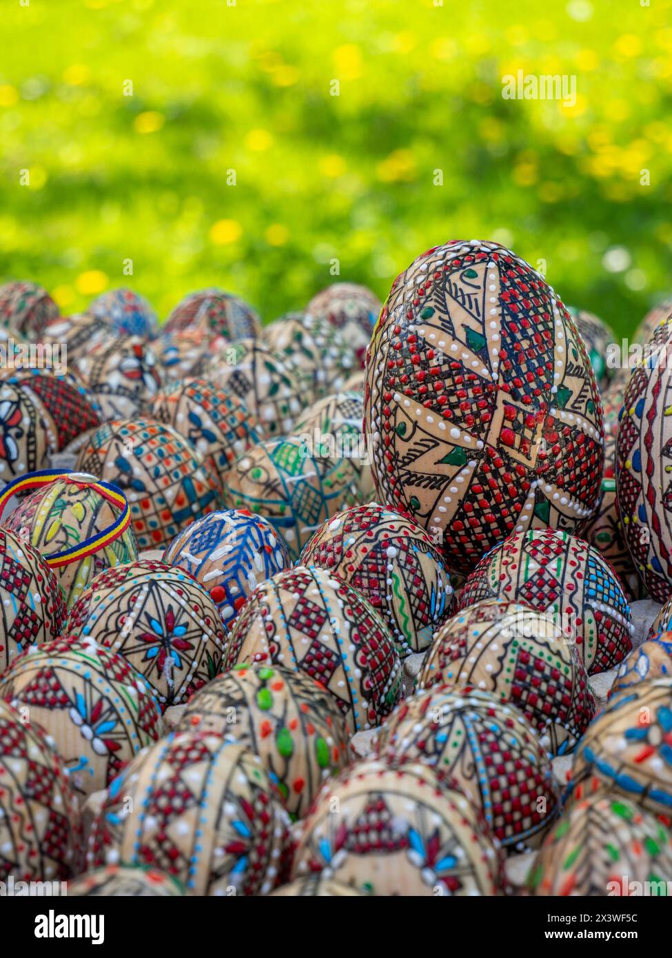 Group of decorated romanian orthodox easter eggs on display stock photo