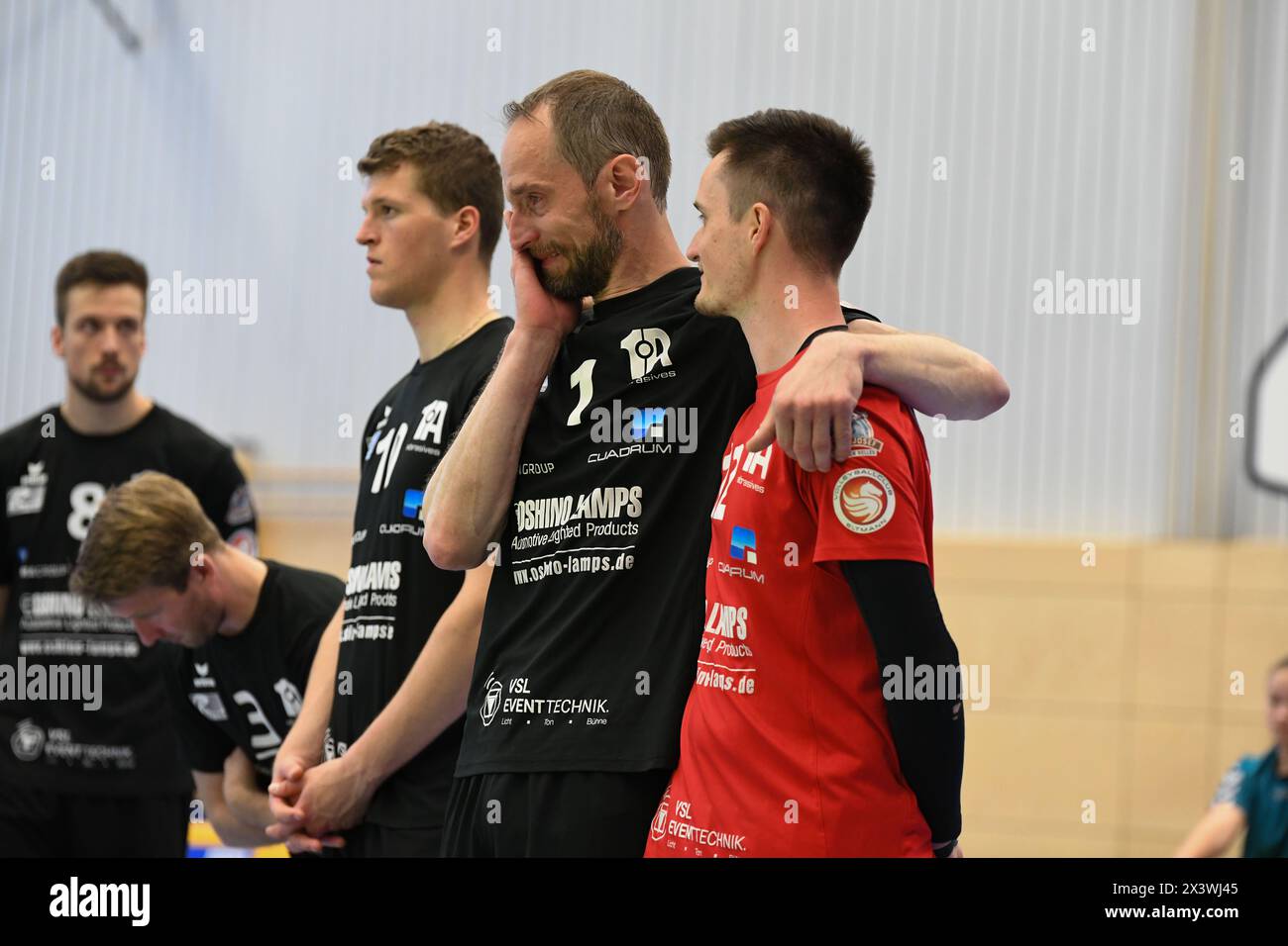 Germany ,Eltmann, Georg Schäfer Halle - 27 May 2024 - 2.Bundesliga, Volleyball - VC Eltmann vs. SV Schwaig Volleyball  Image: Christian Nowak (VC Eltmann, 1) gets emotional as Former club President Rolf Werner (VC Eltmann) receiving a certificate from the Volleyball Bundesliga for 50 years as a member of VC Eltmann e.V.; embraces Rolf’s son Tobias Werner (VC Eltmann, 12). Credit: Ryan Evans/Alamy Live News Stock Photo