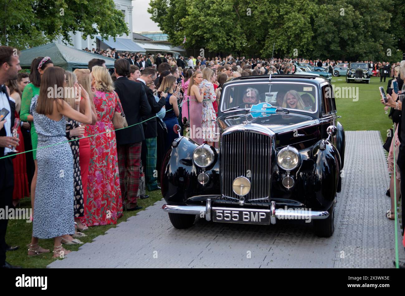 Hurlingham Club annual summer party members and their friends show off their vintage and classic cars in the Concourse d'Elégance, ie owners drive the cars around the grounds of the club. Fulham, London, England 11th June 2022 UK 2020s HOMER SYKES Stock Photo