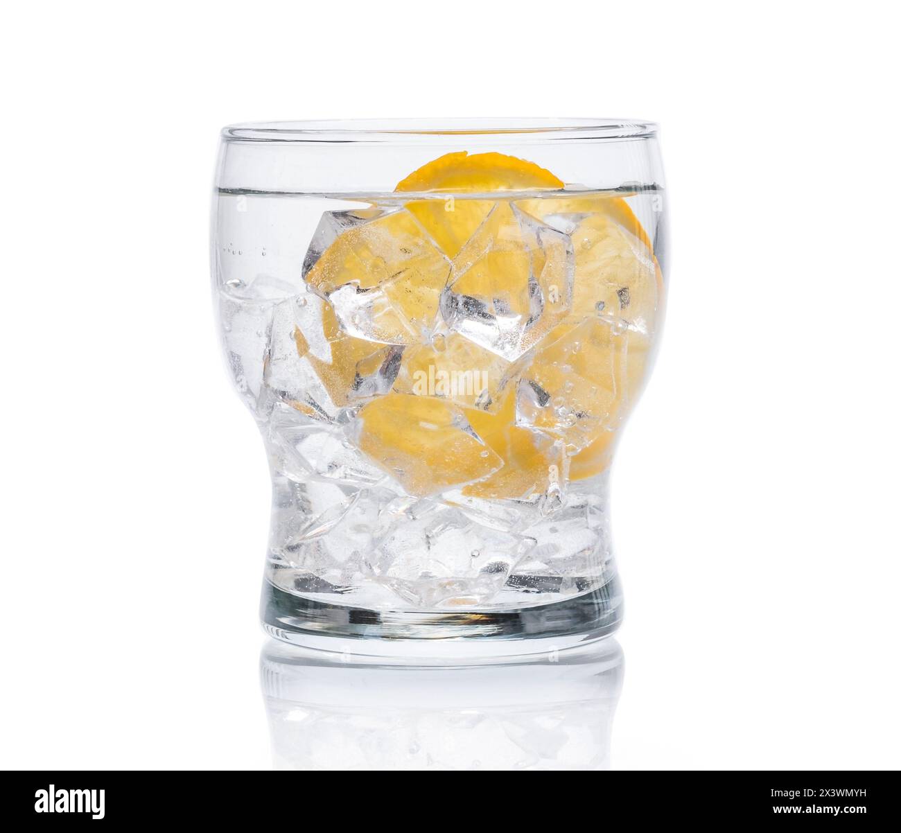 glass with cold water with ice and lemon isolated on a white background ...