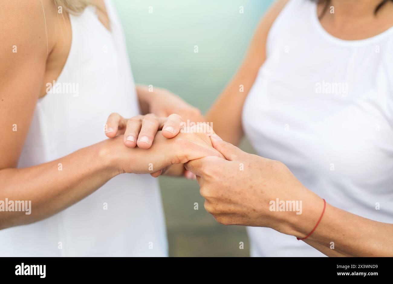 Close up of mother and daughter holding hands Stock Photo - Alamy