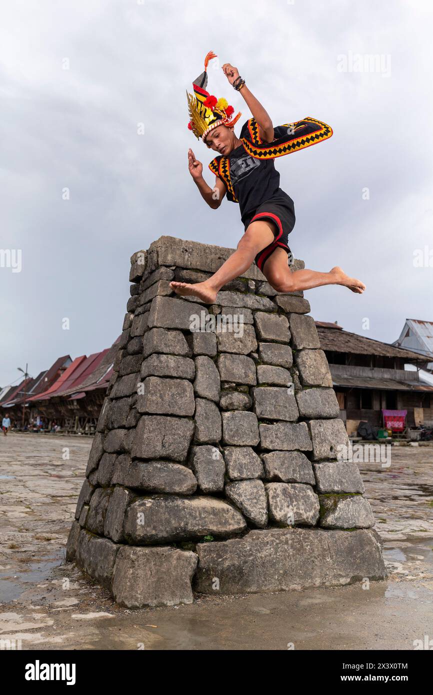 Traditional stone jumping, Bawomataluo village, Teluk Dalam, South Nias Regency, North Sumatra Province, Indonesia. Stock Photo