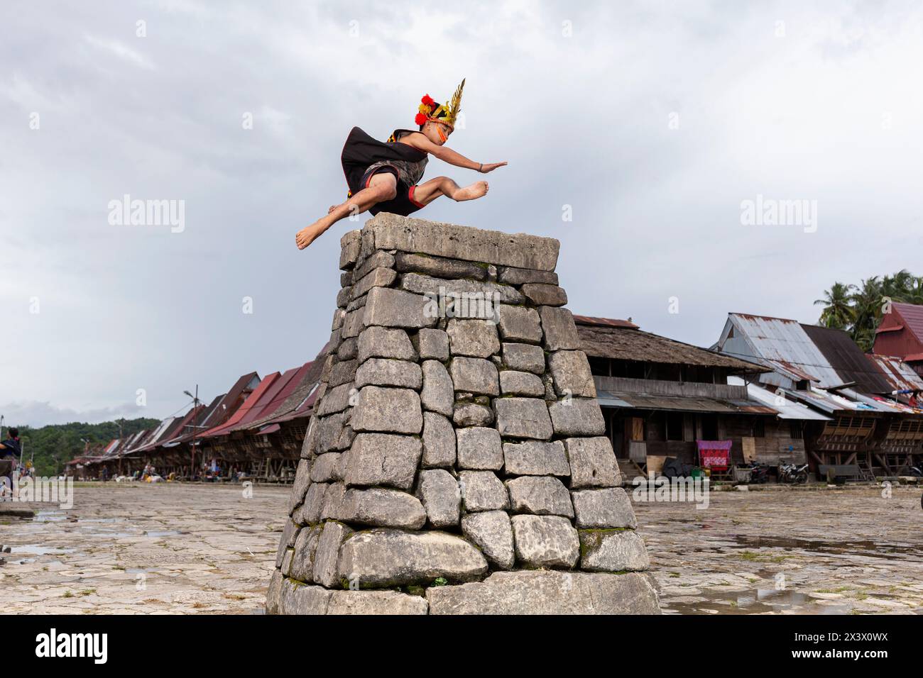 Traditional stone jumping, Bawomataluo village, Teluk Dalam, South Nias Regency, North Sumatra Province, Indonesia. Stock Photo