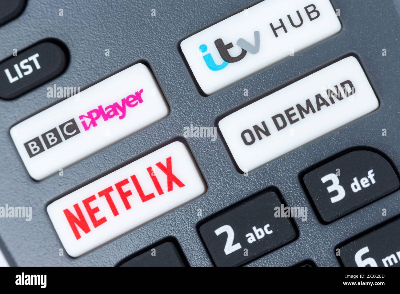 Close-Up Of a Freesat Remote Control which has buttons for Netflix, BBC iPlayer, itv Hub and On Demand Stock Photo