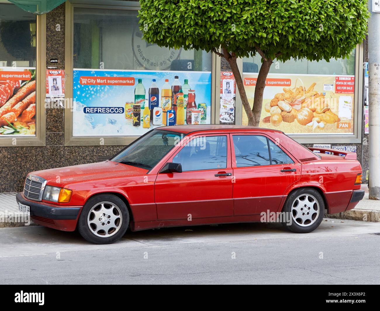 Mercedes-Benz 190 (W201) parked on the street. Málaga province, Spain. Stock Photo