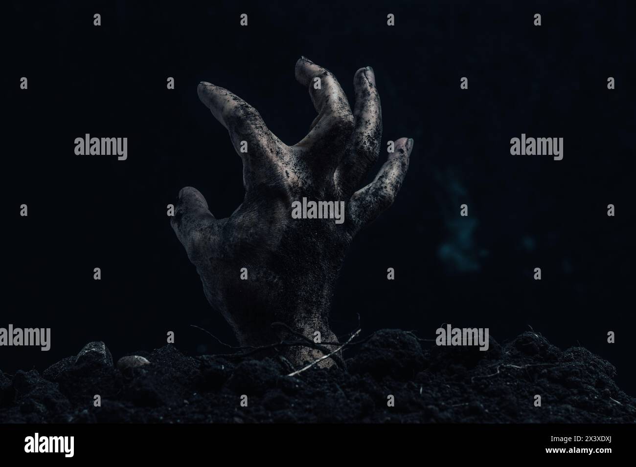 Zombie hand on dark background. Halloween concept. Horror theme Stock Photo