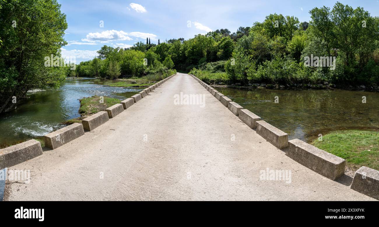 Sommieres, France - 04 15 2024: View of a typical stone bridge in the south of France Stock Photo