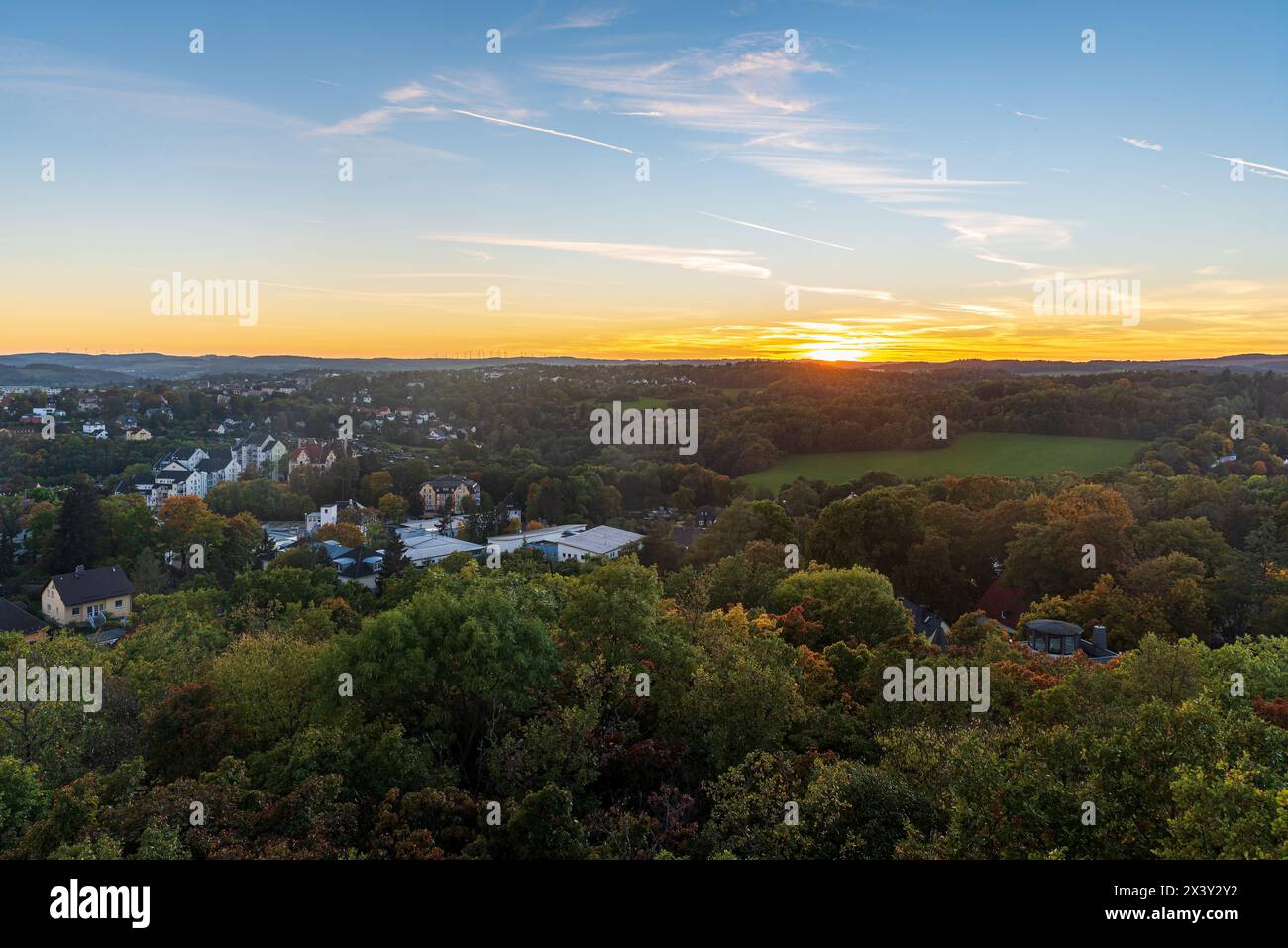 Autumn sunset with colorful sky from Barenstein hill above Plauen city in Germany Stock Photo