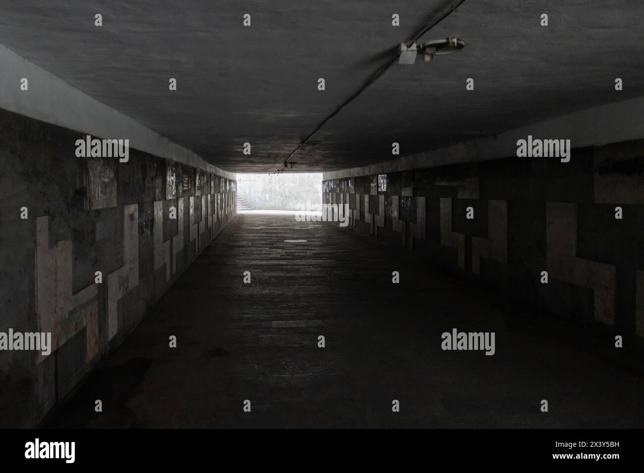Pedestrian underpass tunnel dark empty and dangerous Stock Photo