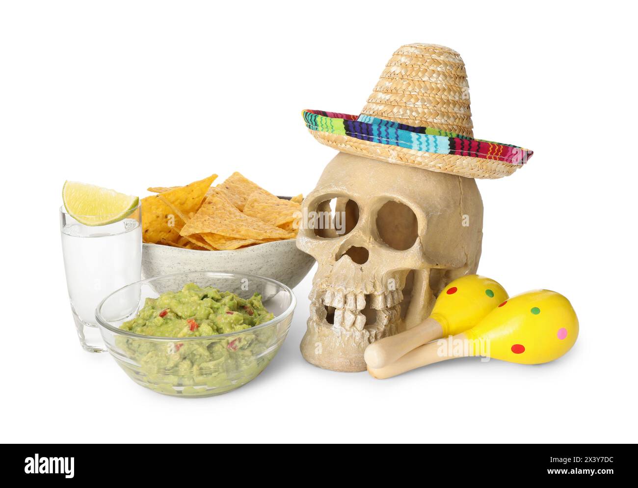 Mexican sombrero hat, human scull, maracas, tequila, nachos chips and