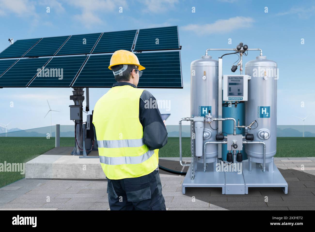 Engineer with tablet computer on a background of Hydrogen factory Stock Photo