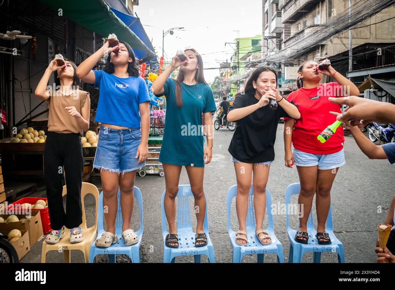 Filipino children play street games together during an annual religious