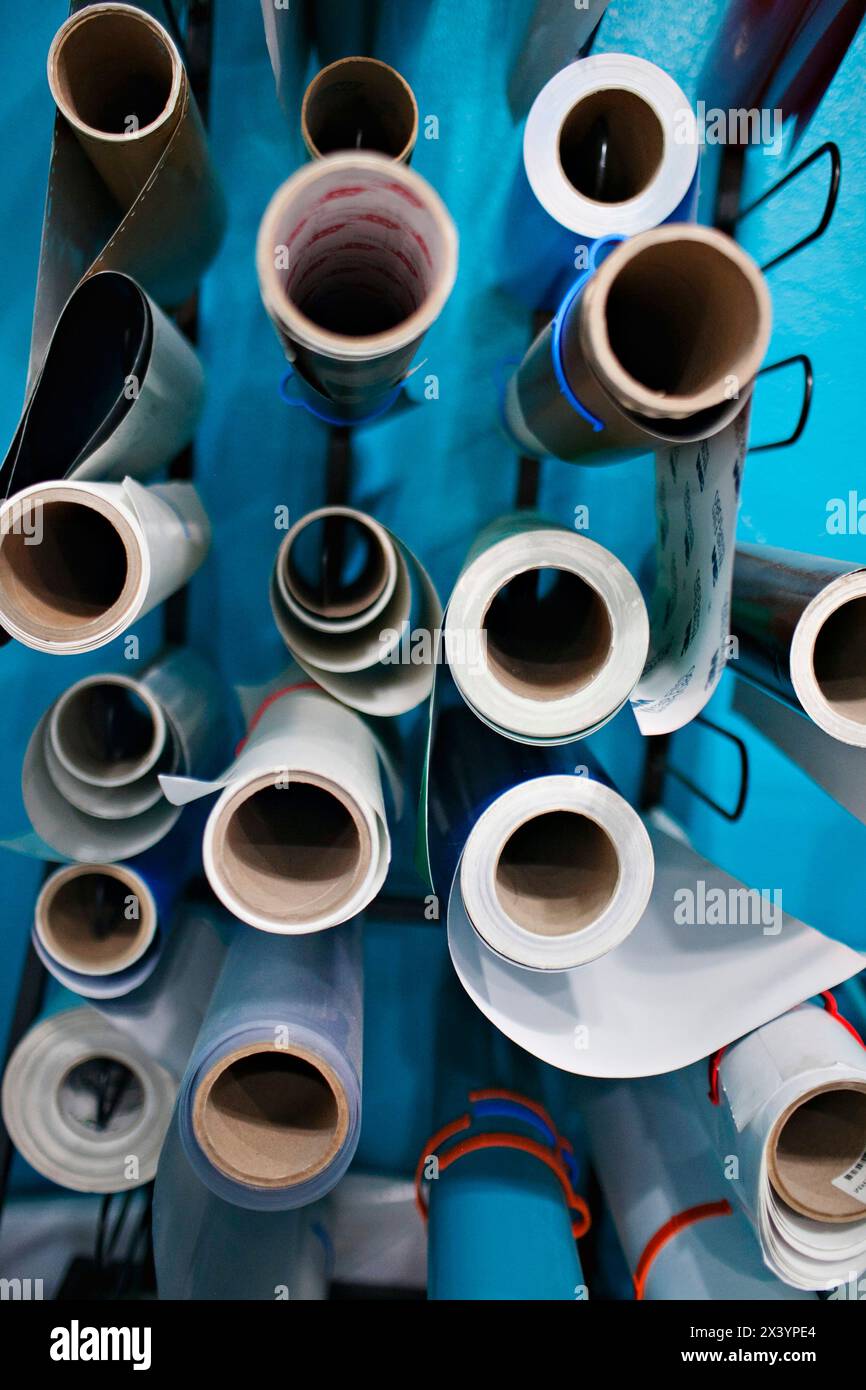 Overhead view of organized blueprints in a creative workspace. Stock Photo