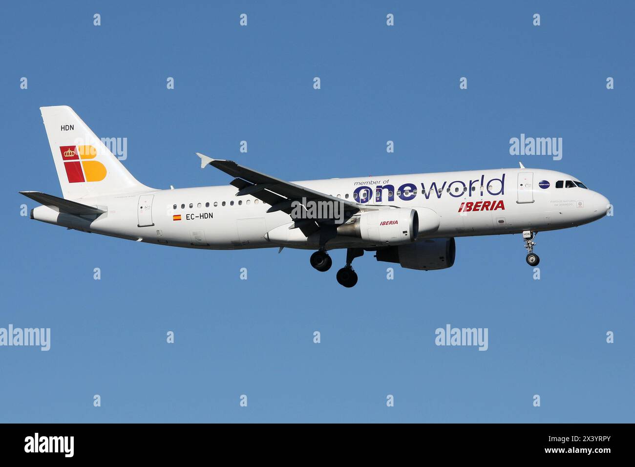 Spanish Iberia Airbus A320-200 with registration EC-HDN in Oneworld Alliance livery on final for Dusseldorf Airport Stock Photo