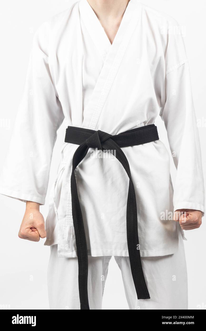 A 15 year old Karate Blackbelt boy, wearing A Gi with his black belt Stock Photo