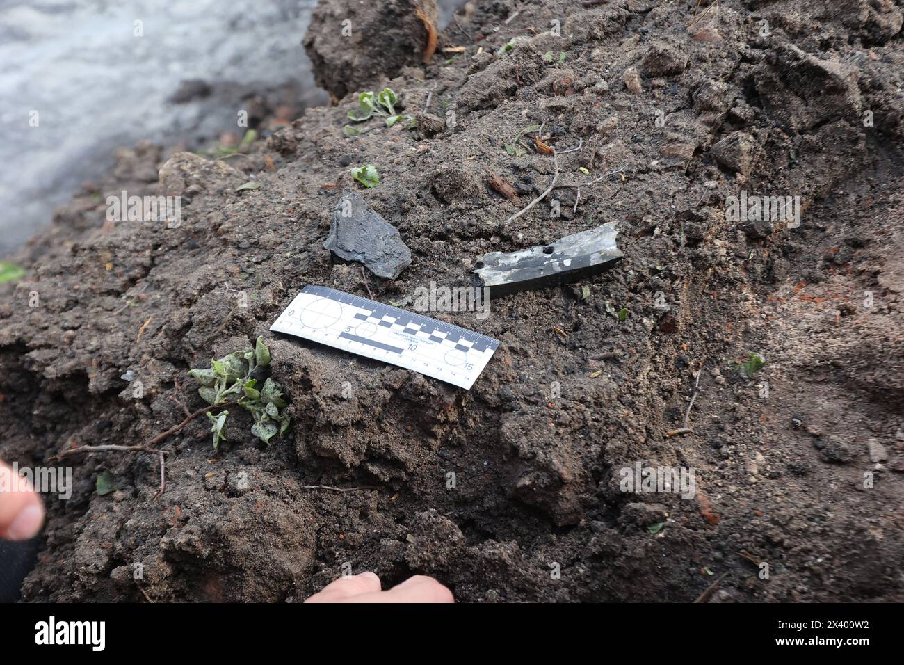 KHARKIV, UKRAINE - APRIL 27, 2024 - A photomacrographic scale lies on the ground at Psychiatric Hospital N3 in the Saltivskyi district following a nighttime Russian S-300 missile strike, Kharkiv, northeastern Ukraine. On April 27 at 00:30 local time, Russian troops attacked Psychiatric Hospital N3 in Kharkiv with S-300 air defence missiles. Windows, roof, out-of-use building, food block, boiler room and other buildings were damaged. A 53-year-old woman was injured. There were 60 patients and 5 hospital staff members during the strike. Stock Photo