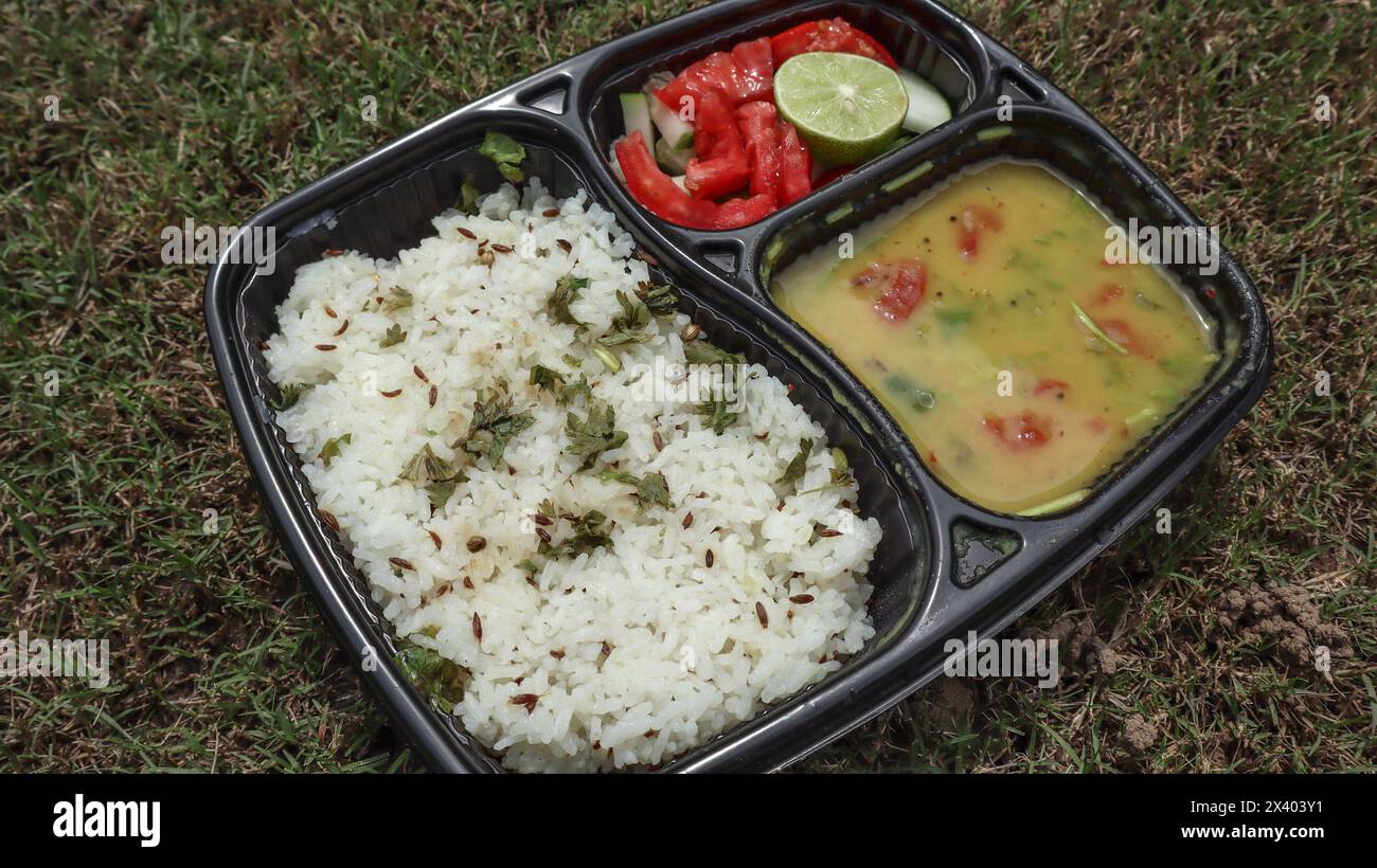 Jeera rice dal fry served with Salad in lunch platter Stock Photo - Alamy