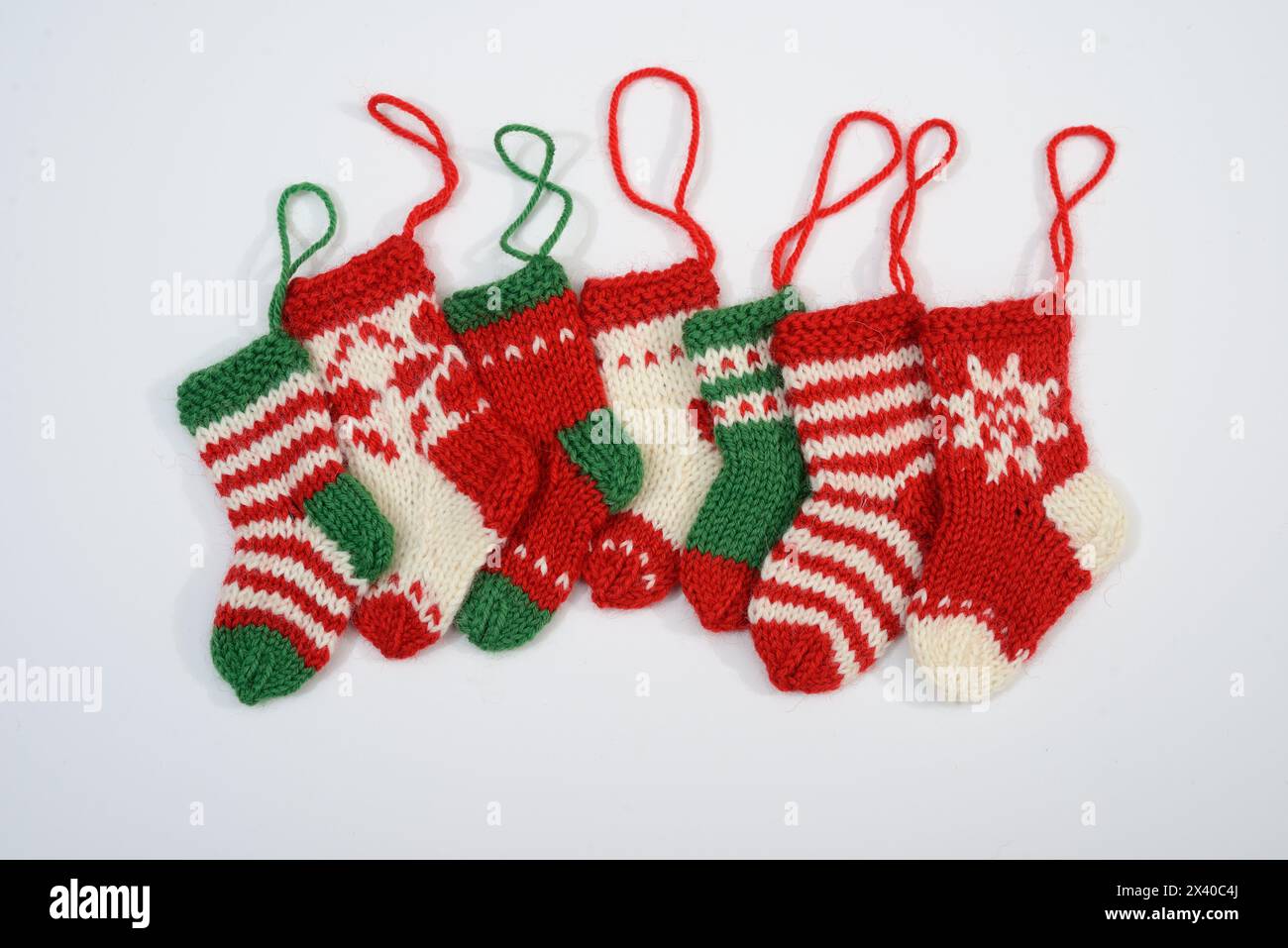 Cozy family tradition captured in handcrafted holiday stockings, adorned with festive designs and warm memories Stock Photo