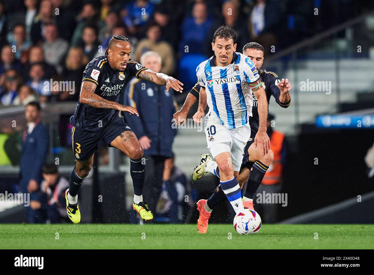 Mikel Oyarzabal of Real Sociedad compete for the ball with Eder Militao of Real Madrid CF during the LaLiga EA Sports match between Real Sociedad and Stock Photo