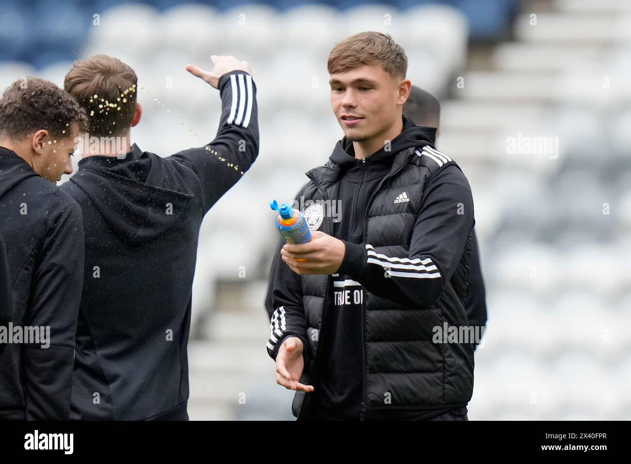 Callum Doyle of Leicester City squirts a drink while he inspects the pitch before the Sky Bet Championship match Preston North End vs Leicester City at Deepdale, Preston, United Kingdom, 29th April 2024  (Photo by Steve Flynn/News Images) Stock Photo