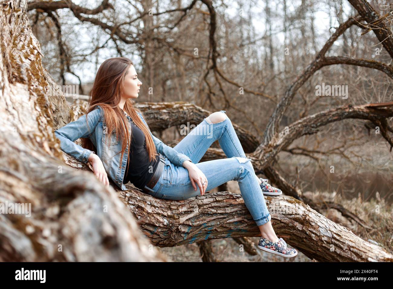 Young girl sits hi-res stock photography and images - Alamy