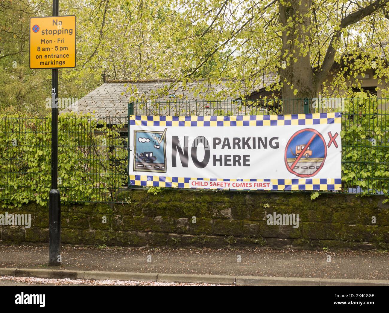 A large No Parking sign outside a primary school in Roundhay, Leeds, Yorkshire, England, UK Stock Photo