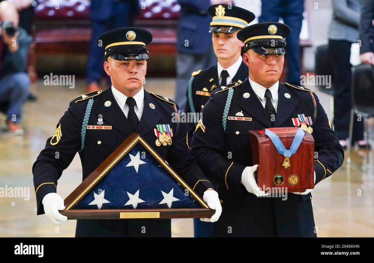 Washington, United States. 29th Apr, 2024. A military honor guard carries an urn bearing the remains of retired Army Col. Ralph Puckett, the last surviving Medal of Honor recipient for acts performed during the Korean War, to lie in honor in the Rotunda at the U.S. Capitol in Washington DC, on Monday, April 29, 2024. Puckett died on April 8, at his home in Columbus, Ga., at the age of 97. Pool photo by Shawn Thew/UPI Credit: UPI/Alamy Live News Stock Photo