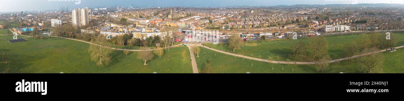 London- Aerial view of London skyline showing train leaving Herne Hill Station and city and residential buildings in background Stock Photo