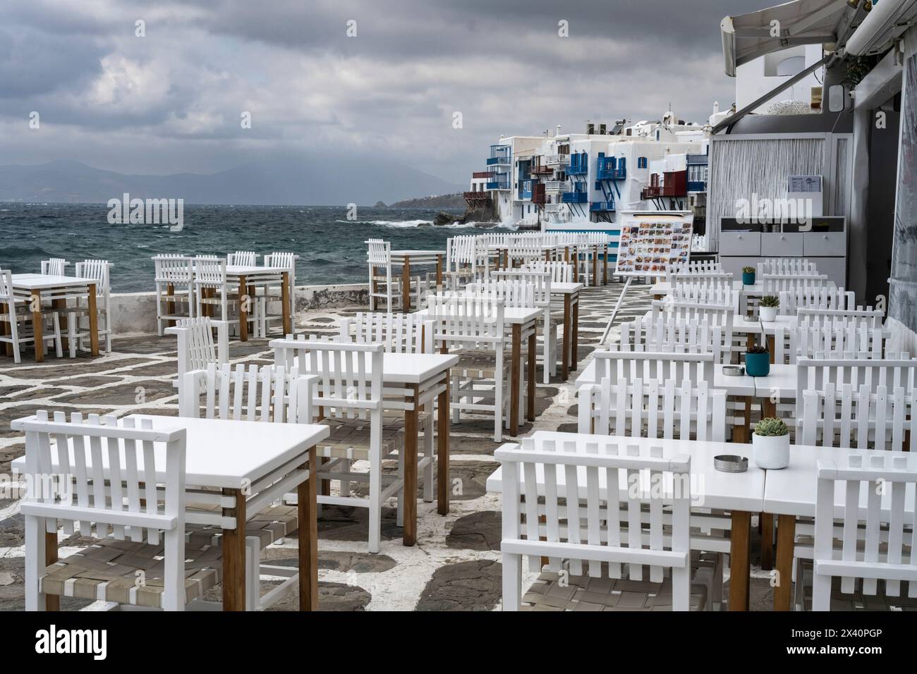 Seating on an outdoor waterfront restaurant patio on the island of ...