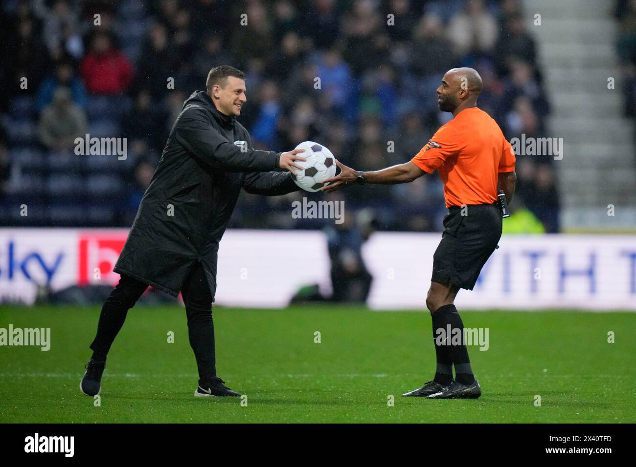 Preston, UK. 29th Apr, 2024. Referee Sam Allison hands an inflatable ...