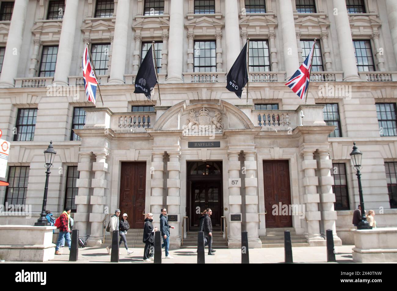 Old War Office, Whitehall, Westminster, London, UK - now a Hotel (Owo Hotel),  many pedestrians walking past. Stock Photo
