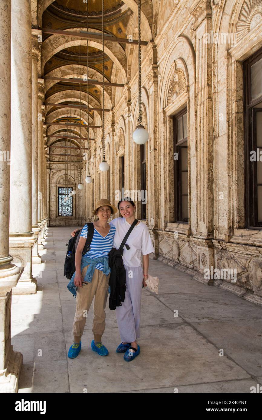 Female tourists at the Alabaster Mosque (Muhammad Ali Mosque) in Cairo, Egypt; Cairo, Egypt Stock Photo