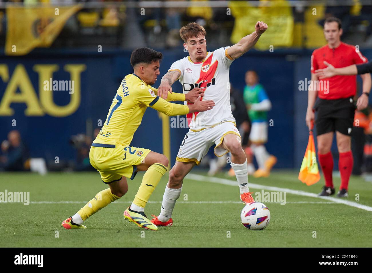 Villarreal, Spain. 29th Apr, 2024. VILLARREAL, SPAIN - APRIL 28: Ilias Akhomach Right Winger of Villarreal CF competes for the ball with Pep Chavarria, Left-Back of Rayo Vallecano during the LaLiga EA Spots match between Villarreal CF and Rayo Vallecano at Estadio de la Ceramica, on April 28, 2024 in Villarreal, Spain. (Photo By Jose Torres/Photo Players Images) Credit: Magara Press SL/Alamy Live News Stock Photo