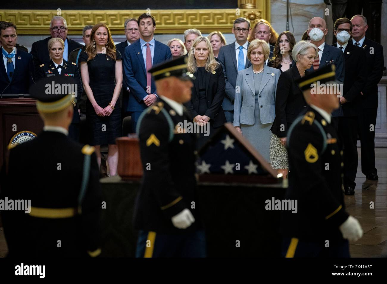 Washington, USA. 29th Apr, 2024. Family members watch as a procession carrying the remains of Col. Ralph Puckett Jr. arrives to lie in honor at the U.S. Capitol, in Washington, DC, on Monday, April 29, 2024. President Biden awarded the Medal of Honor to Col. Puckett in 2021, and he was the last surviving medal recipient for acts performed during the Korean War. (Graeme Sloan/Sipa USA) Credit: Sipa USA/Alamy Live News Stock Photo