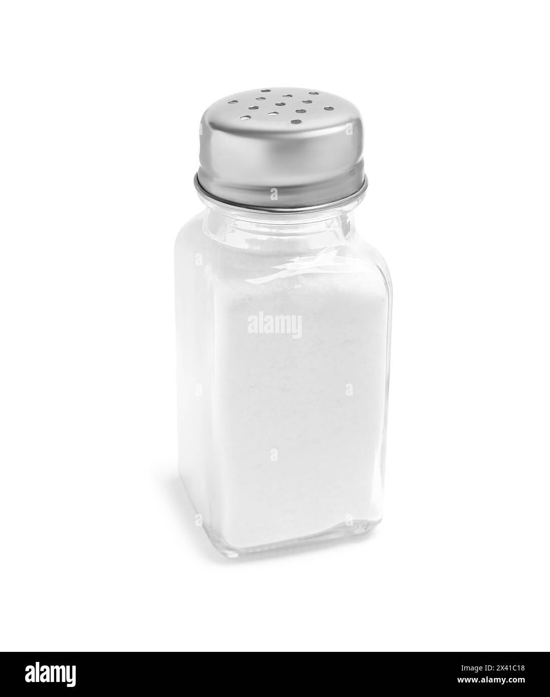 Natural salt in glass shaker isolated on white Stock Photo