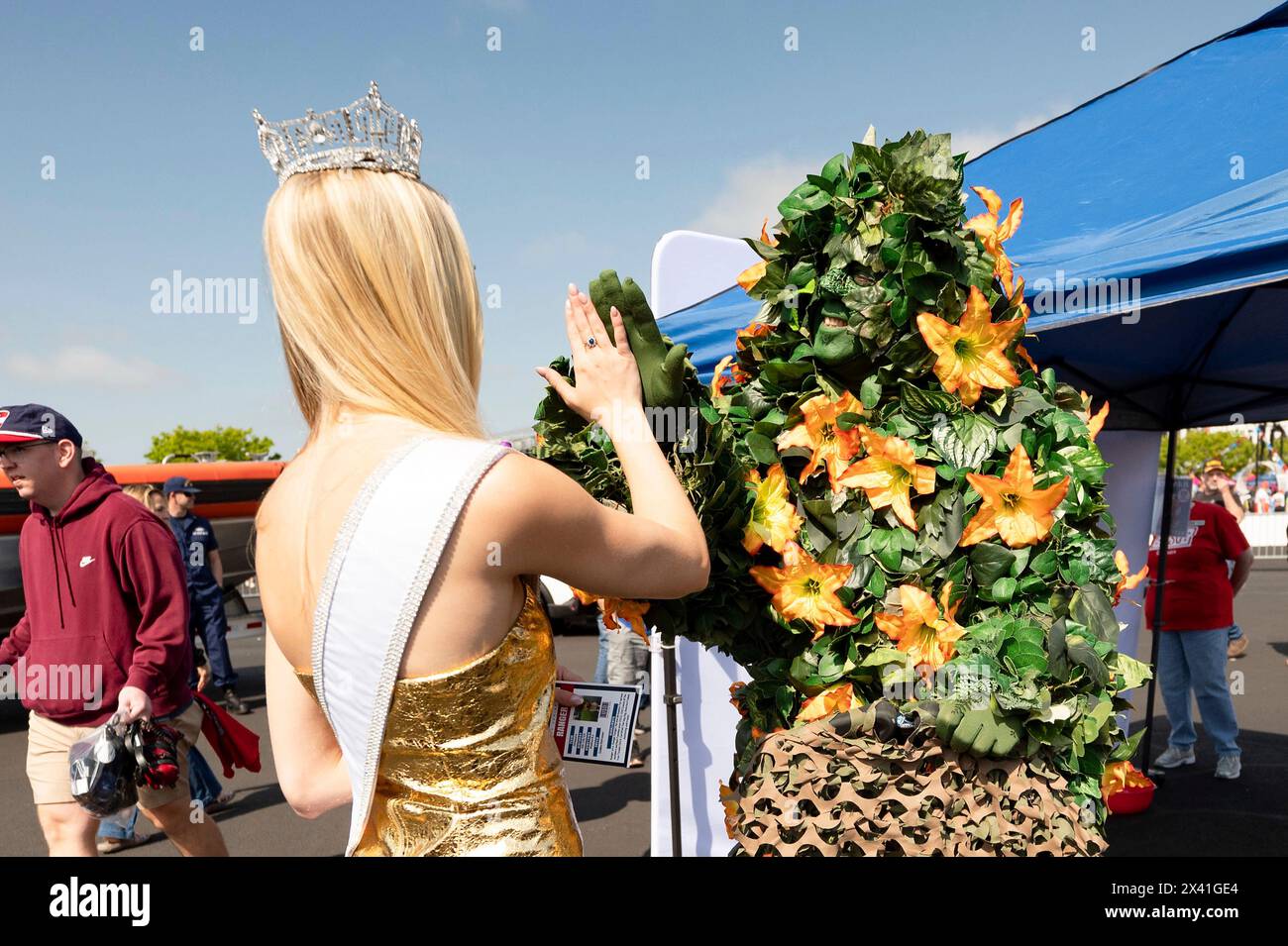 Dover, United States Of America. 28th Apr, 2024. Dover, United States of America. 28 April, 2024. U.S Air Force 2nd Lt. Madison Marsh, Miss America 2024, high fives with Miles the Monoster before the Würth 400 NASCAR race at the Dover Motor Speedway, April 28, 2024 in Dover, Delaware. Marsh, a 22-year-old U.S. Air Force Academy graduate is the first active duty military officer to hold the crown as Miss America. Credit: Miriam Thurber/U.S Air Force Photo/Alamy Live News Stock Photo