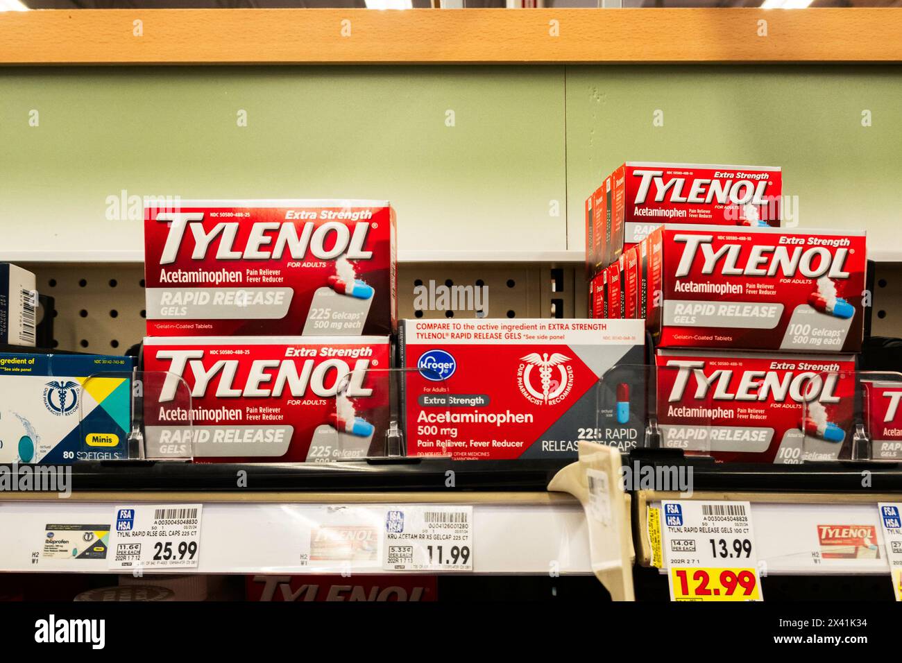 Market shelf holding boxes of Tylenol brand acetaminophen tablets for pain & fever. USA. Stock Photo