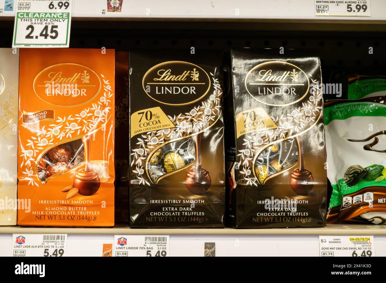 Lindt or Lindor, Lindt Lindor packages of milk chocolate or dark chocolate truffles on a market shelf. USA. Stock Photo