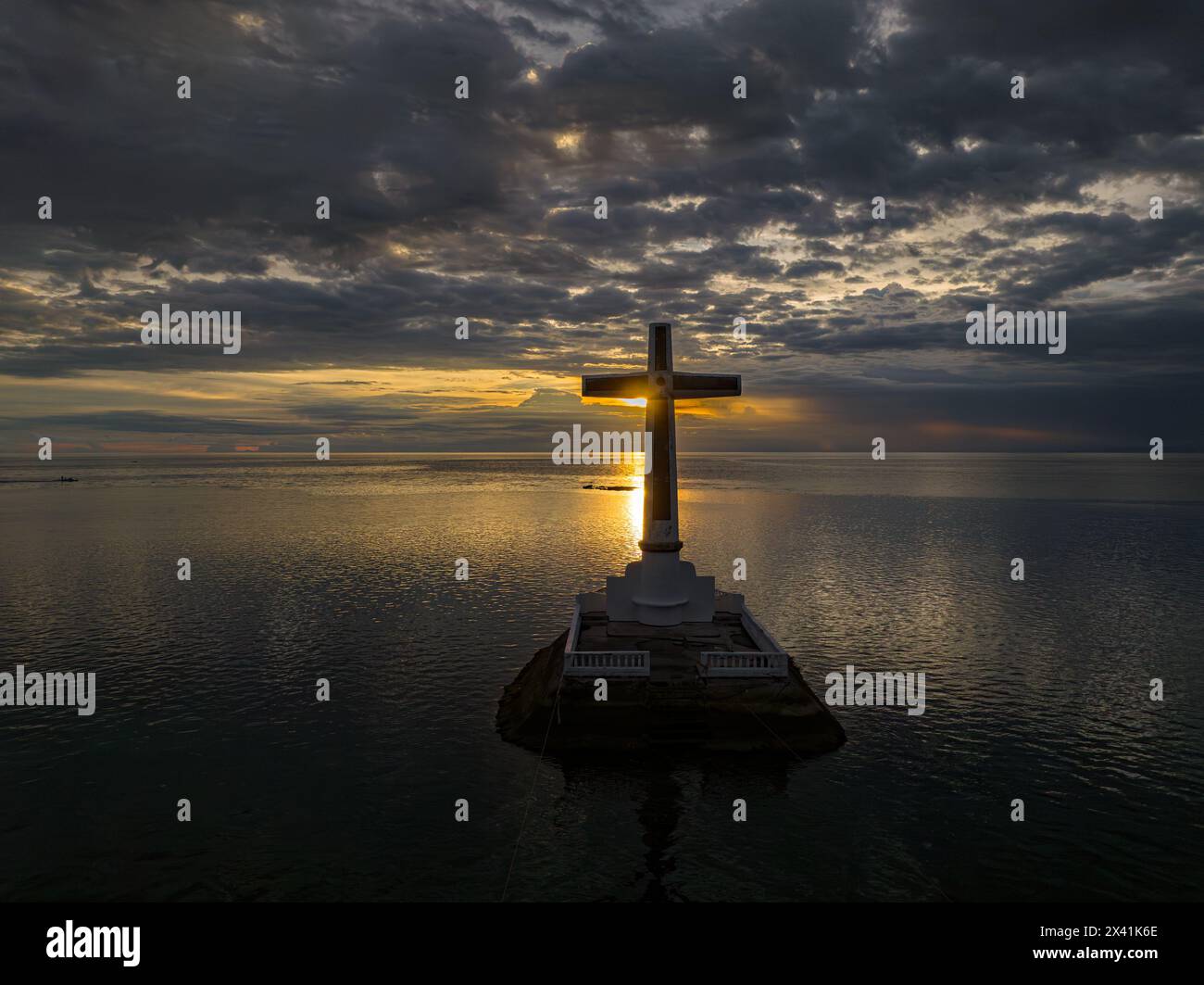 Sunken Cemetery with sunset background in Camiguin Island. Historical landmark in the Philippines. Travel destination. Twilight over the sea. Stock Photo