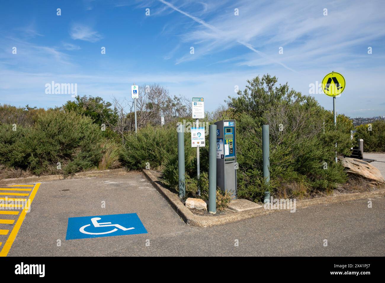 Parking bay for disabled drivers to use and adjacent parking ticket machine, North Head,Sydney,NSW,Australia Stock Photo