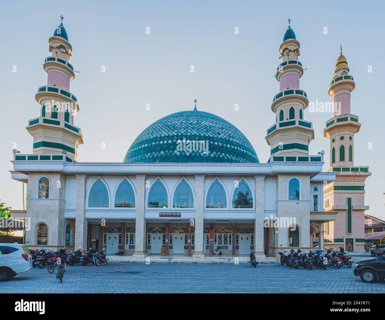 Balikpapan, Indonesia - April 12th, 2024. a beautiful old mosque bathed in the warm light of sunset.It is estimated that it was built around the 1890s Stock Photo