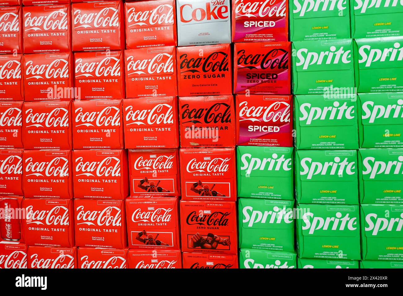 A grocery store display of 12 packs of assorted varieties of Coke and Sprite sodas Stock Photo