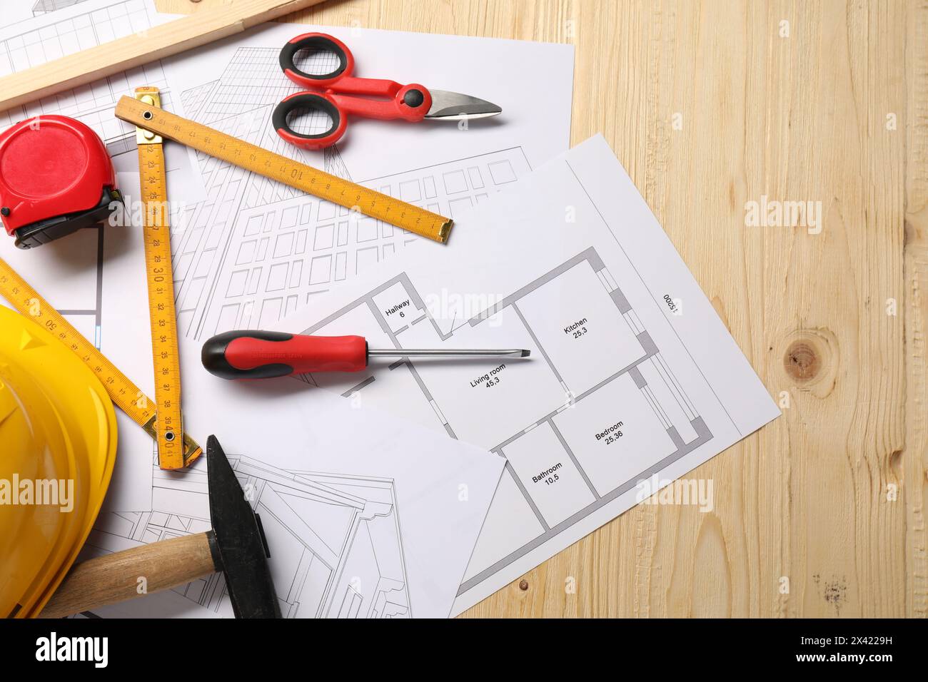 Flat lay composition with different construction tools on wooden background Stock Photo